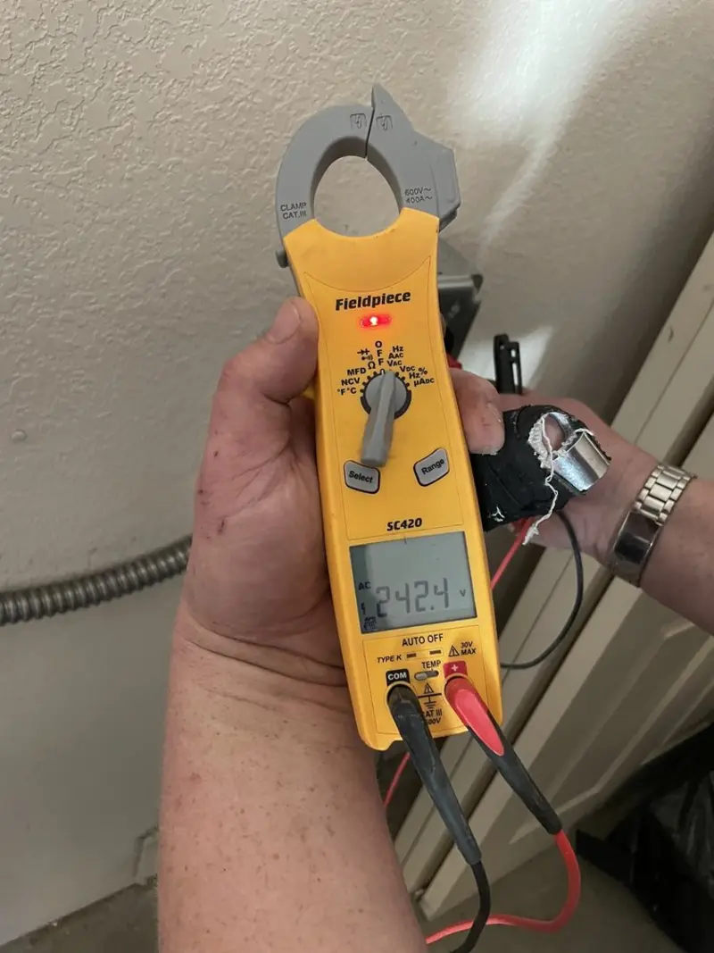 Voltage testing with clamp meter during Generator Installation in Oceola